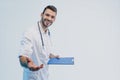 Smiling young european male doctor hold clipboard Royalty Free Stock Photo