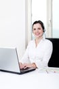 Smiling young female callcenter agent with headset