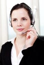 Smiling young female callcenter agent with headset