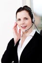 Smiling young female callcenter agent with headset