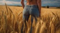 smiling young female farmer cowgirl standing in wheat cereal field. copy space