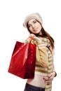 Smiling young female holding shopping bag on white Royalty Free Stock Photo