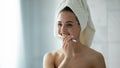 Young female brush teeth in bathroom in morning Royalty Free Stock Photo