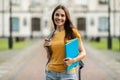 Smiling Young Female Student With Workbooks And Backpack Standing Outdoors Royalty Free Stock Photo
