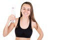 Smiling young fitness woman bottle of water on white background