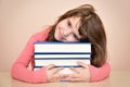 Smiling young girl and books Royalty Free Stock Photo