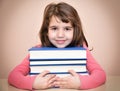 Smiling young girl and books Royalty Free Stock Photo