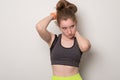 Smiling young girl is engaged in fitness. Teen girl in sportswear. Sport girl in tank top for yoga