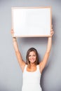 Smiling young girl holding blank board Royalty Free Stock Photo