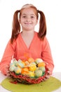 Smiling young girl holding easter eggs basket Royalty Free Stock Photo
