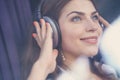 Smiling young girl listening to music Royalty Free Stock Photo