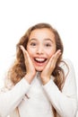 Smiling young girl looking happily surprised with hands on her chin isolated