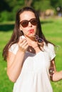 Smiling young girl with soap bubbles in park Royalty Free Stock Photo