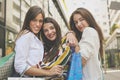 Smiling young girl standing together on city street. Girls after Royalty Free Stock Photo