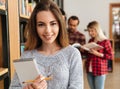 Smiling young girl student holding textbook Royalty Free Stock Photo