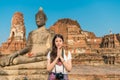 Smiling young girl student visiting Ayutthaya