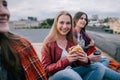 Smiling young girl with takeaway junk food