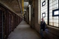 girl visiting the cell galleries of the Old Joliet Prison Royalty Free Stock Photo