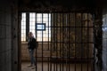 girl visiting the cell galleries of the Old Joliet Prison Royalty Free Stock Photo