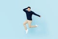Smiling young handsome Asian man jumping Royalty Free Stock Photo