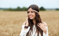 Smiling young hippie woman on cereal field Royalty Free Stock Photo