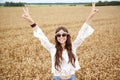 Smiling young hippie woman on cereal field Royalty Free Stock Photo