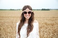 Smiling young hippie woman on cereal field Royalty Free Stock Photo