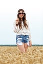 Smiling young hippie woman on cereal field Royalty Free Stock Photo