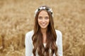 Smiling young hippie woman on cereal field Royalty Free Stock Photo