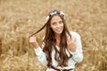 Smiling young hippie woman on cereal field Royalty Free Stock Photo