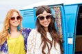 Smiling young hippie women over minivan car Royalty Free Stock Photo