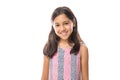 Smiling young hispanic girl posing and looking at the camera over white background Royalty Free Stock Photo