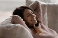 Happy Hispanic woman relax at home taking nap Royalty Free Stock Photo