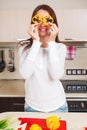 Smiling young housewife mixing fresh salad Royalty Free Stock Photo