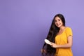 Smiling Young Indian Woman Brushing Long Hair With Wooden Comb Royalty Free Stock Photo