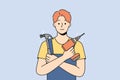 Smiling repairman with tools in hands