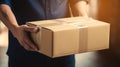 Smiling young male postal delivery courier man in front of cargo van delivering package Royalty Free Stock Photo