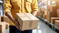 Smiling young male postal delivery courier man in front of cargo van delivering package Royalty Free Stock Photo