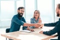 Smiling young man answering employers ` questions during the interview Royalty Free Stock Photo