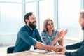 Smiling young man answering employers ` questions during the interview Royalty Free Stock Photo