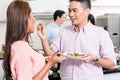 Man feeding food to her girlfriend