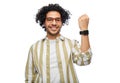 smiling young man in glasses showing smart watch Royalty Free Stock Photo