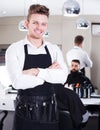 Hairdresser demonstrating his workplace