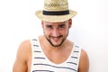 Smiling young man with hat posing against white background Royalty Free Stock Photo