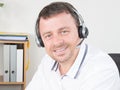 young man with headset working in call center Royalty Free Stock Photo