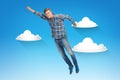 Smiling young man jumping in air Royalty Free Stock Photo