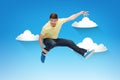 Smiling young man jumping in air Royalty Free Stock Photo