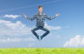 Smiling young man jumping in air