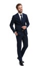 Smiling young man in navy blue suit looking to side Royalty Free Stock Photo