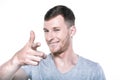 Smiling young man pointing his finger to you Royalty Free Stock Photo